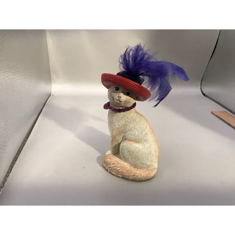 Pretty White Resin Kitty With A Red Hat With Purple Feather